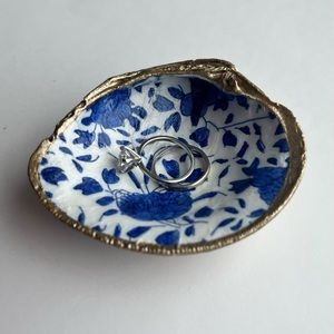 Handmade clam shell ring dish. Blue flower print inside, with gold trim.